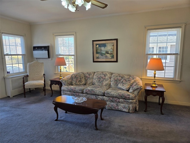 carpeted living room with crown molding, baseboards, and ceiling fan