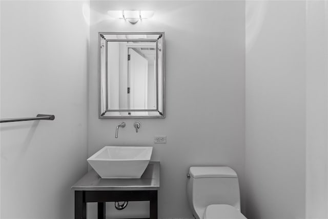 bathroom with a sink and toilet