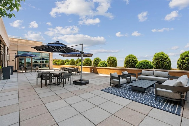 view of patio / terrace with outdoor dining area and an outdoor living space