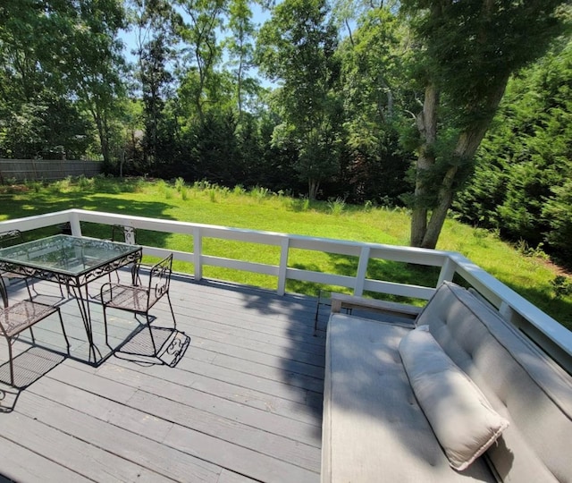 wooden terrace with outdoor dining space