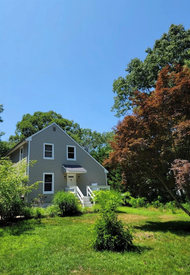 back of house with a yard