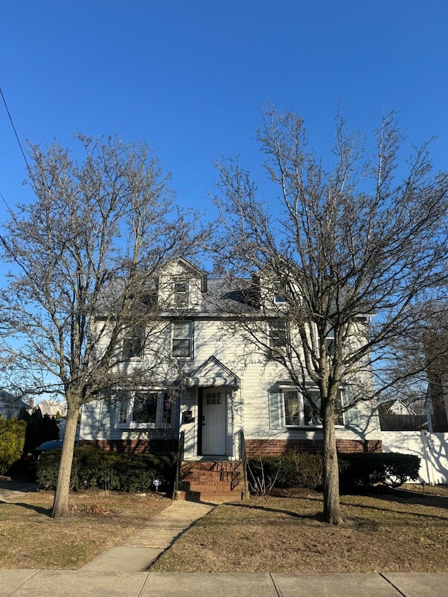 view of front facade featuring brick siding