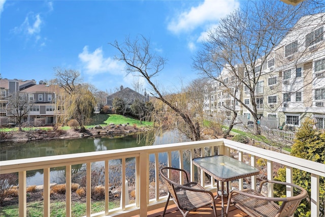 balcony featuring a water view