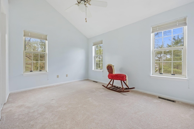 empty room with visible vents, carpet flooring, baseboards, and a ceiling fan