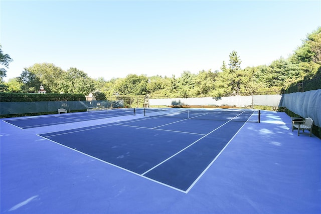 view of sport court featuring community basketball court and fence