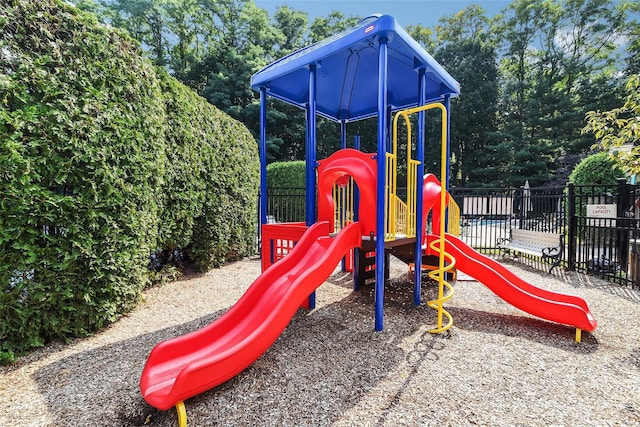 community jungle gym featuring fence