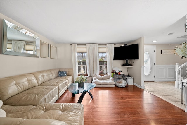 living room featuring stairway and wood finished floors