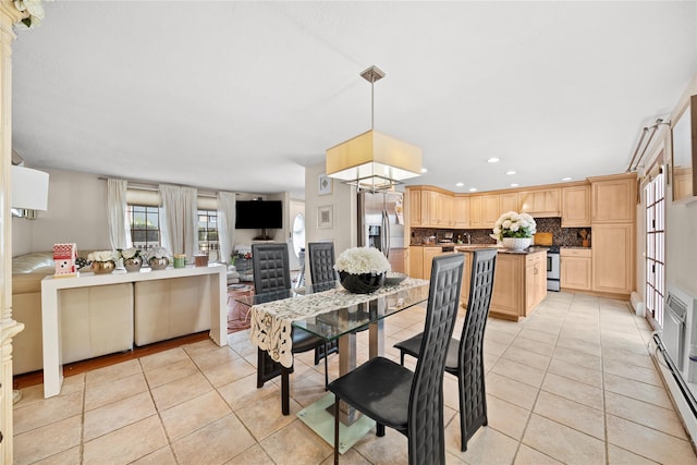 dining space featuring recessed lighting and light tile patterned flooring