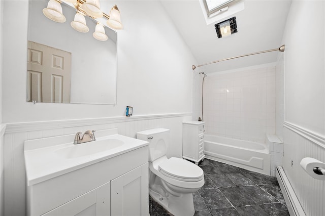 bathroom with a wainscoted wall, toilet, vanity, washtub / shower combination, and a baseboard radiator