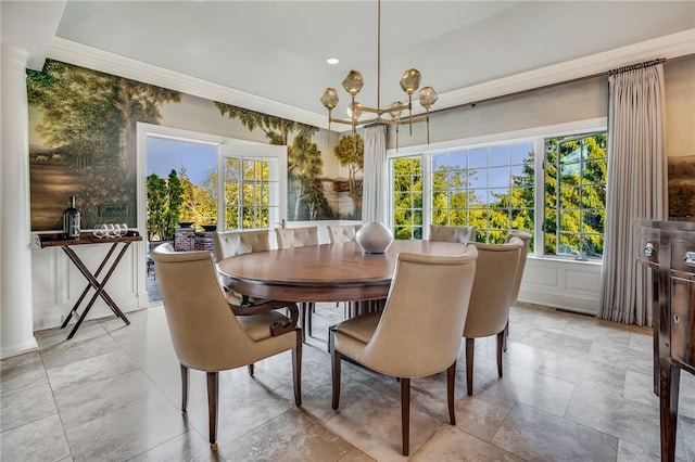 dining area with a decorative wall and a notable chandelier