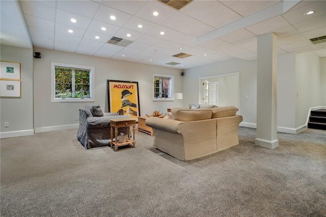 living area featuring carpet floors, baseboards, and visible vents