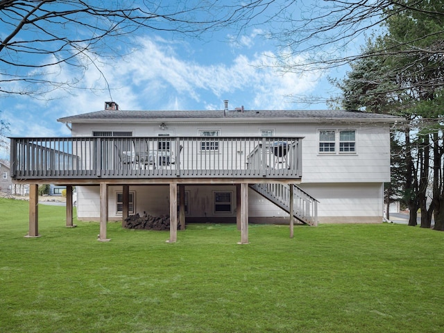 back of property featuring a wooden deck, a lawn, a chimney, and stairs