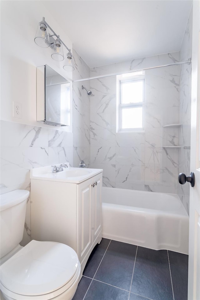 full bath featuring tile walls, shower / bathtub combination, toilet, vanity, and tile patterned floors