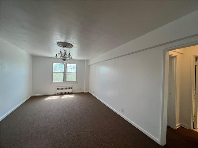 142 Garth Rd Unit 1P, Scarsdale, NY 10583 - empty room featuring radiator, a chandelier, baseboards, and dark colored carpet