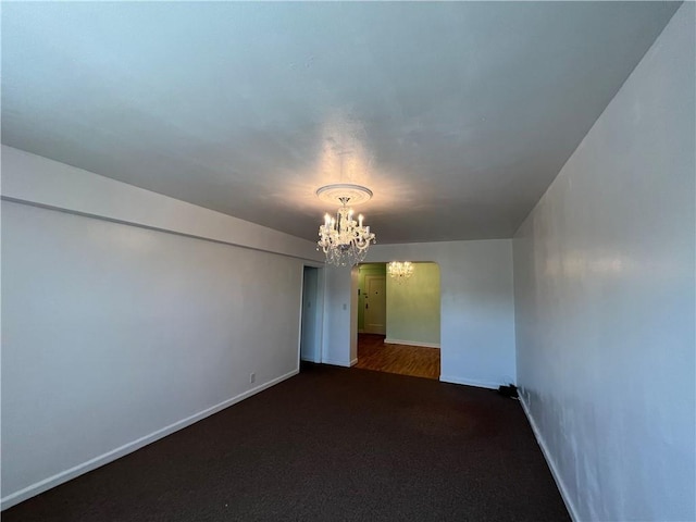 142 Garth Rd Unit 1P, Scarsdale, NY 10583 - carpeted empty room featuring a chandelier and baseboards