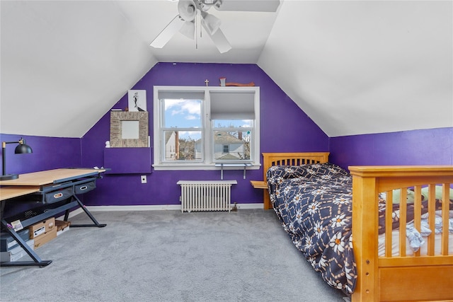 carpeted bedroom featuring ceiling fan, radiator heating unit, baseboards, and vaulted ceiling