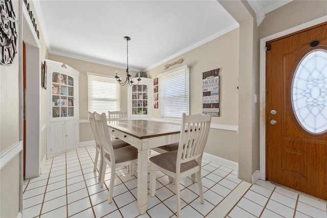 dining space featuring crown molding, an inviting chandelier, and light tile patterned floors