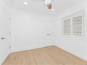 unfurnished room with baseboards, light wood finished floors, a ceiling fan, and recessed lighting