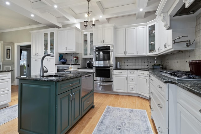 kitchen with white cabinetry, a warming drawer, light wood-style flooring, and stainless steel double oven