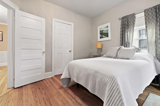 bedroom with wood finished floors