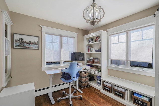 office with a notable chandelier, baseboard heating, and dark wood-style flooring