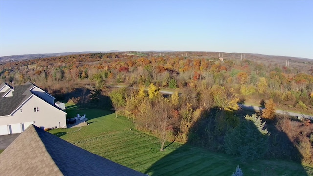 birds eye view of property with a forest view