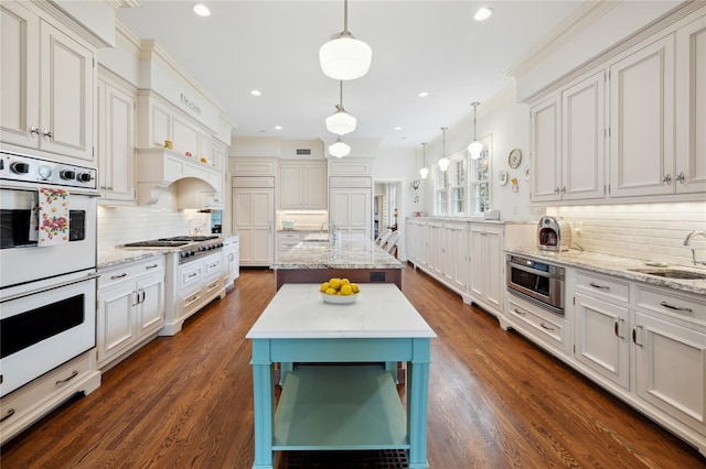 57 Old Orchard Ln, Scarsdale, NY 10583 - kitchen featuring a sink, backsplash, double oven, and dark wood-type flooring