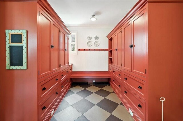 57 Old Orchard Ln, Scarsdale, NY 10583 - mudroom featuring dark floors, ornamental molding, and wainscoting