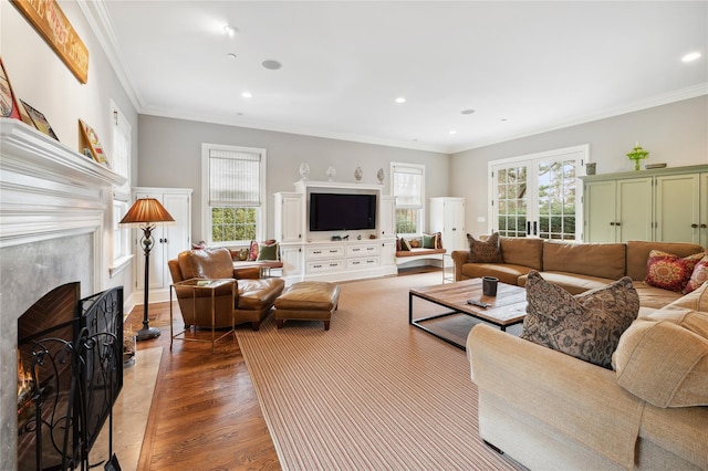 57 Old Orchard Ln, Scarsdale, NY 10583 - living area featuring wood finished floors, ornamental molding, a warm lit fireplace, and recessed lighting