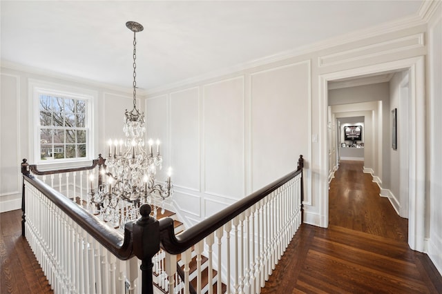57 Old Orchard Ln, Scarsdale, NY 10583 - hall featuring a decorative wall, an upstairs landing, and a chandelier