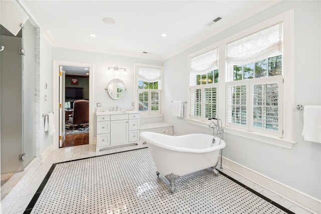 57 Old Orchard Ln, Scarsdale, NY 10583 - bathroom featuring a soaking tub, vanity, ornamental molding, visible vents, and baseboards