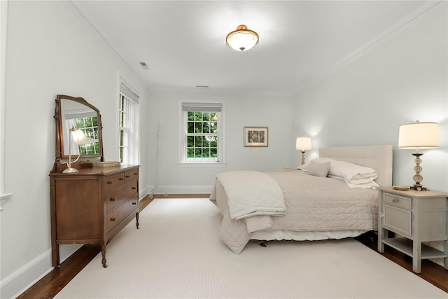 57 Old Orchard Ln, Scarsdale, NY 10583 - bedroom with visible vents, baseboards, ornamental molding, and wood finished floors