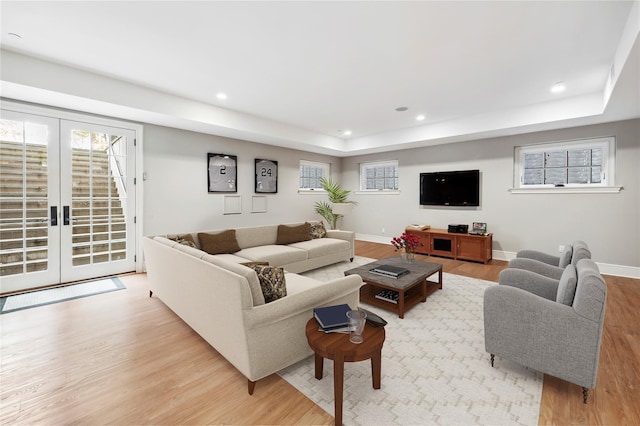 57 Old Orchard Ln, Scarsdale, NY 10583 - living area featuring baseboards, a raised ceiling, recessed lighting, wood finished floors, and french doors