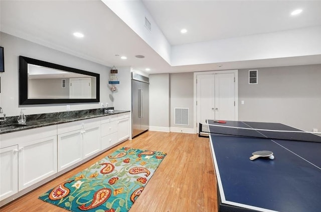 57 Old Orchard Ln, Scarsdale, NY 10583 - recreation room with light wood-type flooring, a sink, visible vents, and recessed lighting