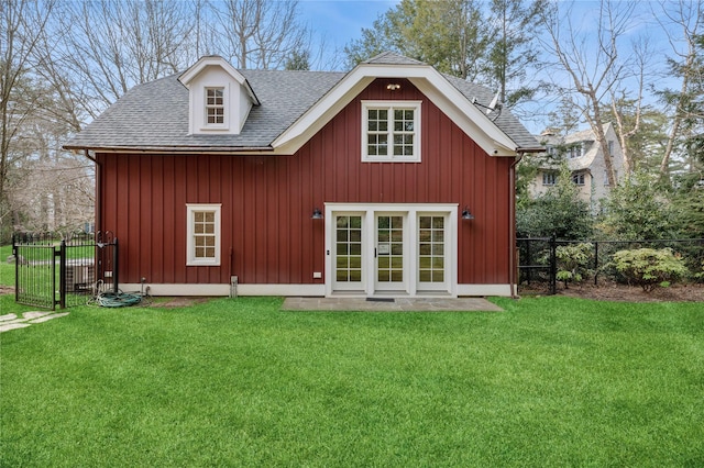 57 Old Orchard Ln, Scarsdale, NY 10583 - back of house with a gate, fence, a shingled roof, and a lawn