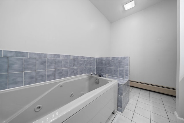 bathroom with a baseboard heating unit, a jetted tub, and tile patterned floors