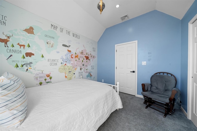 bedroom with lofted ceiling, dark carpet, visible vents, and baseboards