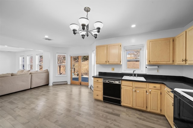 kitchen featuring light brown cabinets, a baseboard heating unit, a sink, dishwasher, and dark countertops