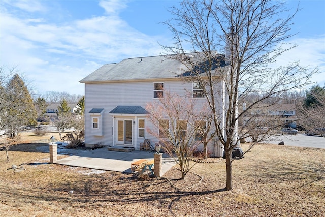 back of house featuring entry steps and a patio area