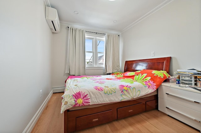 bedroom featuring baseboard heating, ornamental molding, an AC wall unit, wood finished floors, and baseboards