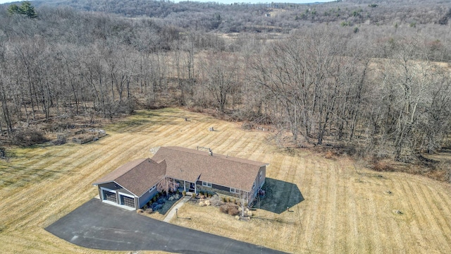 aerial view featuring a wooded view