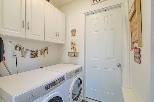 laundry room featuring cabinet space and washing machine and clothes dryer