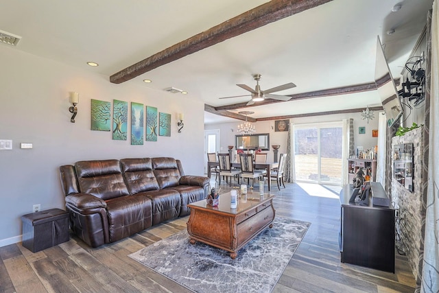 living room with beam ceiling, wood finished floors, and visible vents