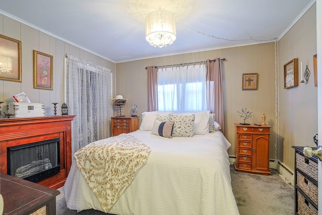 bedroom with ornamental molding, a baseboard heating unit, carpet floors, a fireplace, and a chandelier