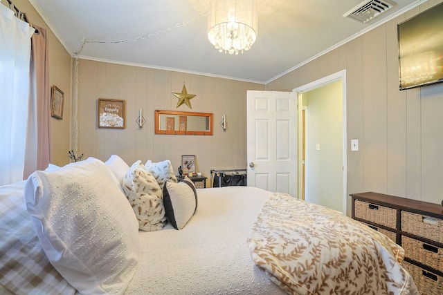 bedroom with visible vents, an inviting chandelier, and ornamental molding