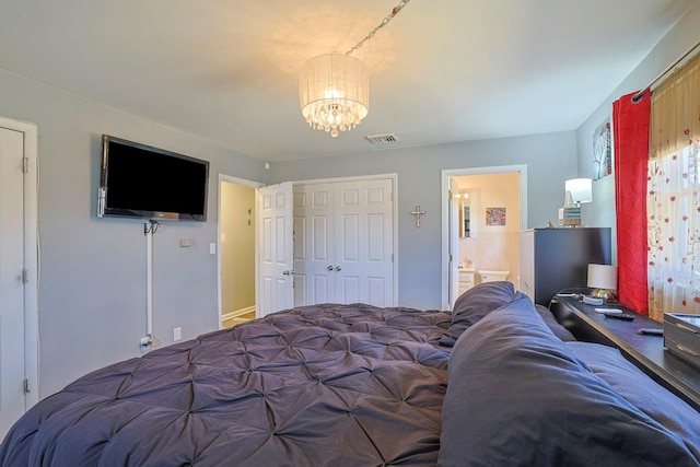 bedroom with an inviting chandelier, visible vents, a closet, and connected bathroom