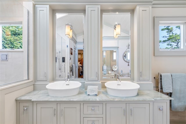 bathroom with double vanity and a sink