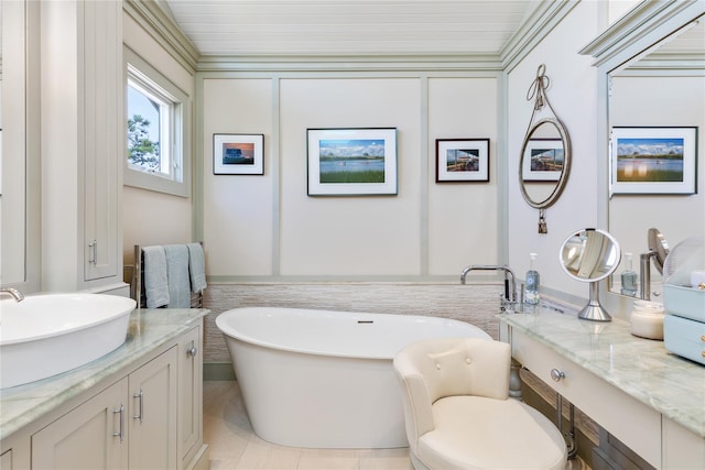 bathroom with a soaking tub and vanity