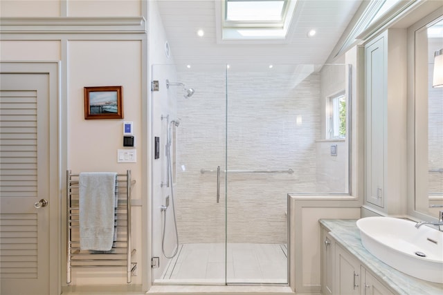 full bath featuring recessed lighting, a shower stall, and vanity