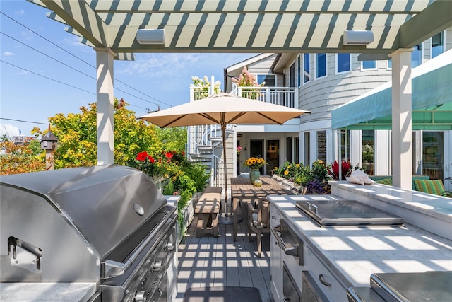 view of patio featuring grilling area and a balcony